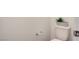 A close-up of a standard toilet with a decorative planter on top of the tank at 11485 Vibrant Heights Dr # 32, Las Vegas, NV 89135
