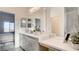 Bright bathroom features double sinks, white quartz countertops, and a separate shower with glass door at 1157 Blossom Point St, Las Vegas, NV 89135