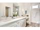 Elegant bathroom featuring double sinks, a vanity area, and modern fixtures at 1157 Blossom Point St, Las Vegas, NV 89135