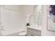 Clean bathroom with a shower and tub combination, complemented by a gray vanity and neutral decor at 1157 Blossom Point St, Las Vegas, NV 89135