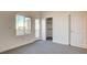 Cozy bedroom featuring a walk-in closet and a window at 1157 Blossom Point St, Las Vegas, NV 89135