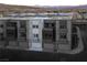 Modern townhome exterior with stone accents, balconies, and individual garages showcasing contemporary design at 1157 Blossom Point St, Las Vegas, NV 89135