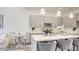 Modern kitchen with gray cabinets, stainless steel appliances, and quartz countertops at 1157 Blossom Point St, Las Vegas, NV 89135