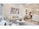 Inviting living room with modern decor, adjacent to a stylish kitchen area at 1157 Blossom Point St, Las Vegas, NV 89135