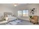 Serene main bedroom with large windows and a relaxing seating area at 1157 Blossom Point St, Las Vegas, NV 89135