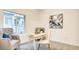 Bright office with a large window, neutral colored furniture, and an accent painting at 1157 Blossom Point St, Las Vegas, NV 89135