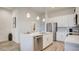 Kitchen featuring stainless steel appliances, quartz countertops, and white cabinetry at 1163 Blossom Point St, Las Vegas, NV 89135