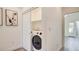 Convenient laundry room featuring modern appliances and storage, making laundry tasks a breeze at 1163 Blossom Point St, Las Vegas, NV 89135