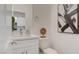 Stylish powder room with white vanity, modern fixtures, and decorative accents for a touch of elegance at 1163 Blossom Point St, Las Vegas, NV 89135