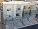 Three-story townhouses feature balconies and attached garages at 1164 Prospering Creek St, Las Vegas, NV 89135