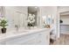 Elegant bathroom featuring dual sinks, ample counter space, and modern fixtures with a closet at 1164 Prospering Creek St, Las Vegas, NV 89135