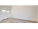 Bare bedroom featuring hardwood floors and a sliding-door closet at 1164 Prospering Creek St, Las Vegas, NV 89135
