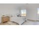 Bright bedroom showcasing a comfortable bed, chic nightstand, and scenic views through the window at 1164 Prospering Creek St, Las Vegas, NV 89135