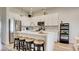 Modern kitchen with white cabinets, stainless steel appliances, and a center island with seating at 1164 Prospering Creek St, Las Vegas, NV 89135