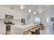 The modern kitchen has stainless steel appliances, sleek countertops, and breakfast bar seating at 1164 Prospering Creek St, Las Vegas, NV 89135