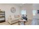 Bright and airy living room with a comfortable sofa, decorative accents, and ample natural light at 1164 Prospering Creek St, Las Vegas, NV 89135