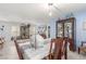 Open-concept dining area with a view into the living room and modern decor at 11739 Village Arbor St, Las Vegas, NV 89183
