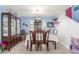 Inviting dining room with classic furnishings and ample natural light at 11739 Village Arbor St, Las Vegas, NV 89183