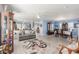 Spacious living and dining area offers ample room to move with wood-look flooring at 11739 Village Arbor St, Las Vegas, NV 89183
