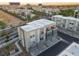 Aerial view of modern townhomes boasting private balconies and garages amidst lush landscaping at 1181 Blossom Point St, Las Vegas, NV 89135