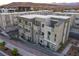 An aerial of townhomes with attached garages, balconies, and professionally landscaped grounds at 1181 Blossom Point St, Las Vegas, NV 89135