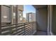 Balcony providing a view of neighboring buildings and a glimpse of greenery at 1187 Blossom Point St # 36, Las Vegas, NV 89135