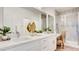 Elegant bathroom features dual sinks, quartz countertops, modern fixtures and walk-in shower at 1187 Blossom Point St # 36, Las Vegas, NV 89135