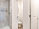 Modern bathroom featuring tiled shower with glass door and toilet in separate area at 1187 Blossom Point St # 36, Las Vegas, NV 89135