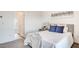 Cozy bedroom featuring soft carpet, neutral decor, and a plush gray headboard at 1187 Blossom Point St # 36, Las Vegas, NV 89135