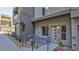 A modern home exterior with muted colors, walkway, and accessible ramp at 1187 Blossom Point St # 36, Las Vegas, NV 89135