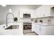 Stylish kitchen with stainless steel appliances and modern fixtures at 1187 Blossom Point St # 36, Las Vegas, NV 89135