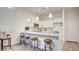 Modern kitchen featuring quartz countertops, white cabinetry, and stainless-steel appliances at 1187 Blossom Point St # 36, Las Vegas, NV 89135