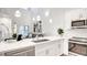 Bright, open kitchen with sleek appliances, modern finishes, and island seating area at 1187 Blossom Point St # 36, Las Vegas, NV 89135