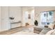 Bright living area with modern decor, hard flooring, and ample natural light from large window at 1187 Blossom Point St # 36, Las Vegas, NV 89135
