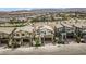 Panoramic aerial view showcasing modern home with desert surroundings and mountain views in a well-planned community at 12123 Glentana View St, Las Vegas, NV 89138