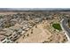 Wide aerial shot of a desert residential area featuring modern homes, scenic pathways, and mountain views at 12123 Glentana View St, Las Vegas, NV 89138