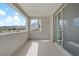 Outdoor balcony featuring mountain and neighborhood views with sleek sliding glass doors at 12123 Glentana View St, Las Vegas, NV 89138