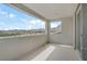View from the balcony overlooking the neighborhood, mountains, and a bright blue sky at 12123 Glentana View St, Las Vegas, NV 89138