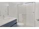 Clean bathroom features a walk-in shower, modern vanity and white fixtures at 12123 Glentana View St, Las Vegas, NV 89138