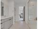 Bathroom with double sinks, glass-enclosed shower and easy access to the main bedroom at 12123 Glentana View St, Las Vegas, NV 89138
