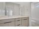 Bathroom with double sink vanity, large mirror, and an enclosed shower/tub at 12123 Glentana View St, Las Vegas, NV 89138