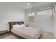 Bedroom showcasing natural light through windows, neutral carpet and a queen bed at 12123 Glentana View St, Las Vegas, NV 89138
