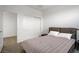 Bedroom with neutral carpet, queen bed, closet, and a doorway to another room at 12123 Glentana View St, Las Vegas, NV 89138