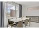 Bright dining room with natural light, modern table, chairs and sleek sideboard storage at 12123 Glentana View St, Las Vegas, NV 89138