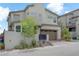 Contemporary two-story home showcasing a modern design with a two-car garage and manicured landscaping at 12123 Glentana View St, Las Vegas, NV 89138