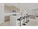 Modern kitchen features a large island, stainless steel appliances and bar stool seating at 12123 Glentana View St, Las Vegas, NV 89138