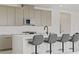 Modern kitchen features a large island, stainless steel appliances and bar stool seating at 12123 Glentana View St, Las Vegas, NV 89138