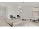 Bright living room with modern furniture, tile floors, and abundant natural light at 12123 Glentana View St, Las Vegas, NV 89138