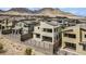 Modern home with an upper balcony, covered patio, desert landscaping, mountain views in an upscale neighborhood at 12123 Glentana View St, Las Vegas, NV 89138