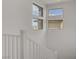 Bright staircase with natural light, white railings and views from three windows at 12123 Glentana View St, Las Vegas, NV 89138
